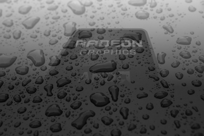High definition AMD Radeon background rained on in black and white.