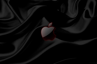 High def wallpaper of black silk with glass Apple logo.